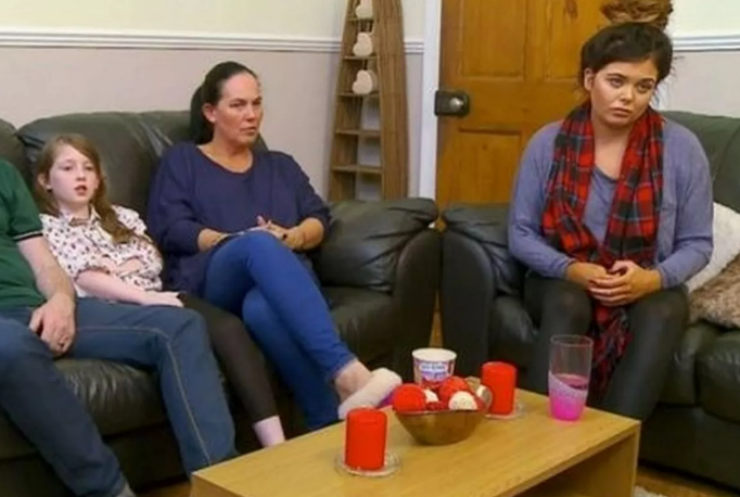 Family sitting on a couch.