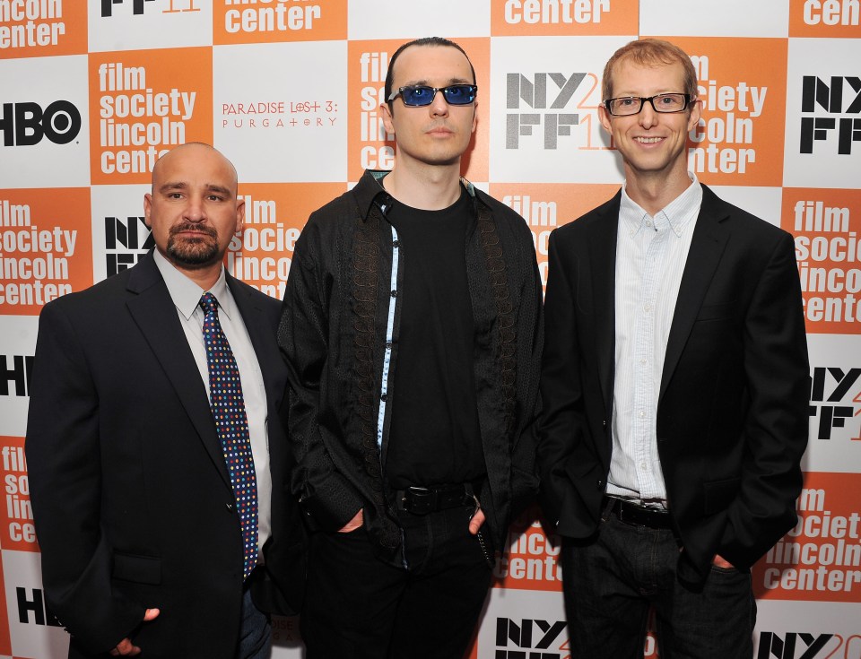 Three men at a film festival.