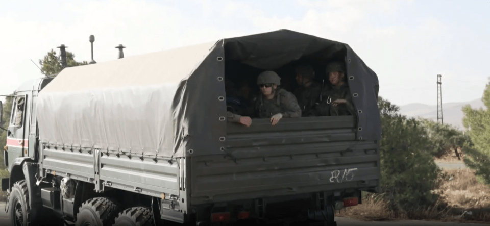Soldiers in a military truck.