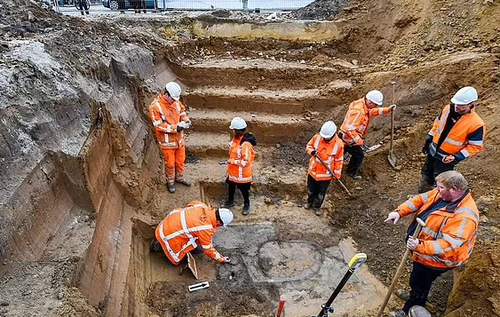 Archaeologists excavating an archaeological site.