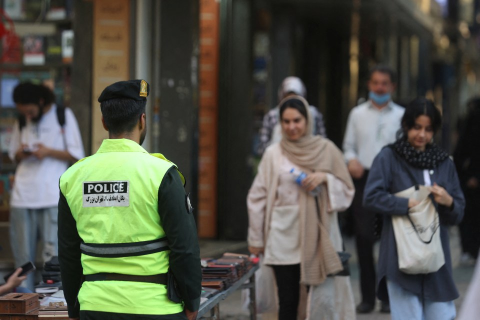 Iranian police officer on a street.