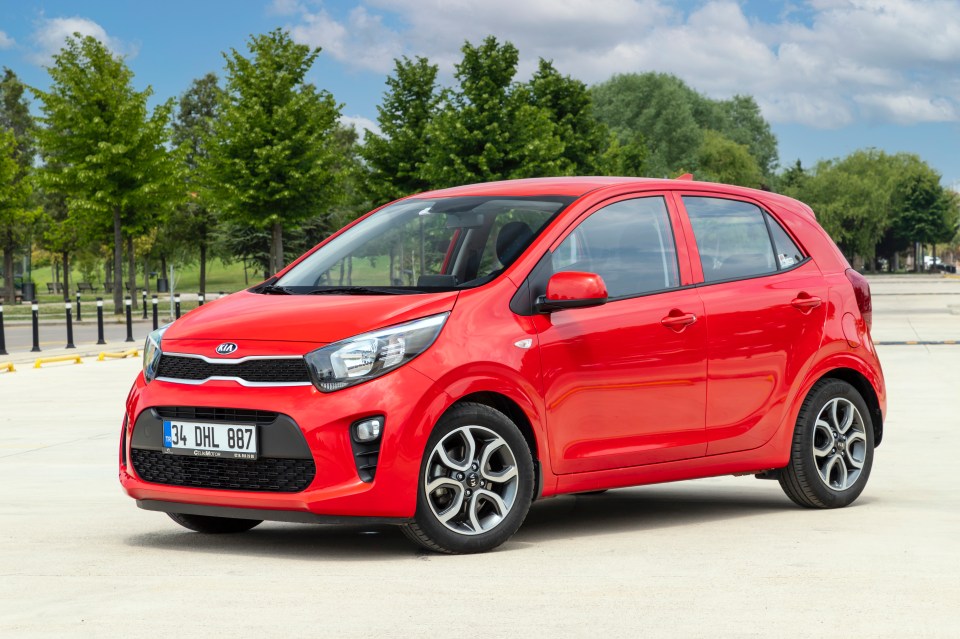 Red Kia Picanto city car.