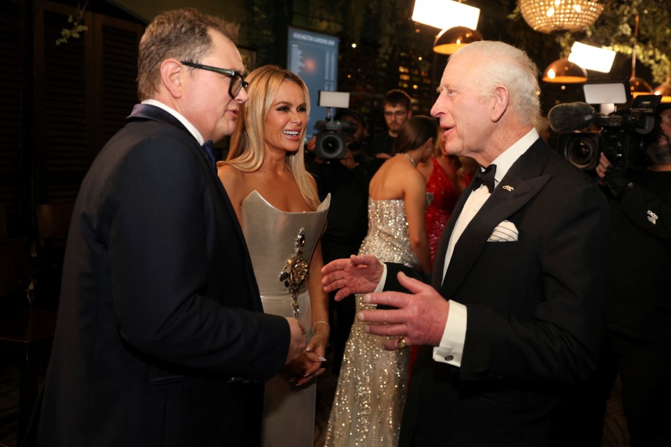 King Charles III speaks with Alan Carr and Amanda Holden at the Royal Albert Hall.