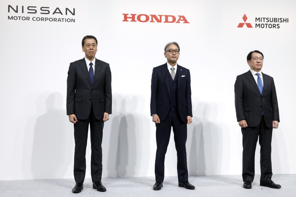 Nissan, Honda, and Mitsubishi Motors CEOs at a press conference.