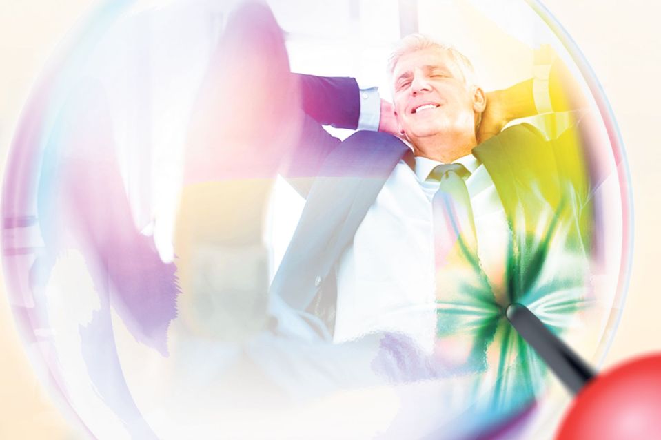Relaxed businessman inside a bubble being targeted by a dart.