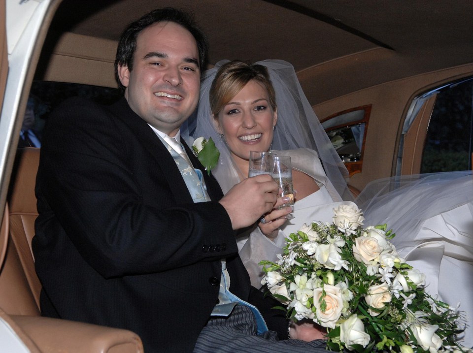 Newlywed couple in a car, celebrating with champagne.