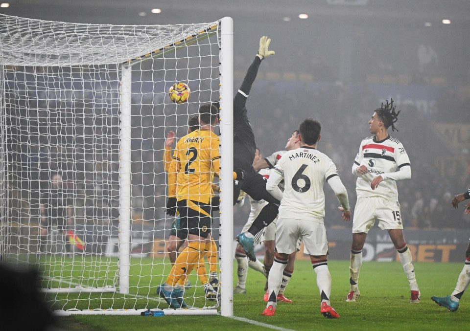 Soccer goal with ball entering the net.
