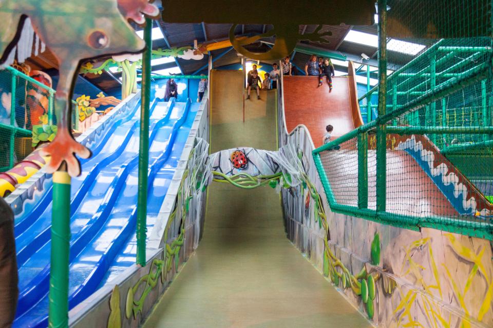 Indoor adventure playground with slides.