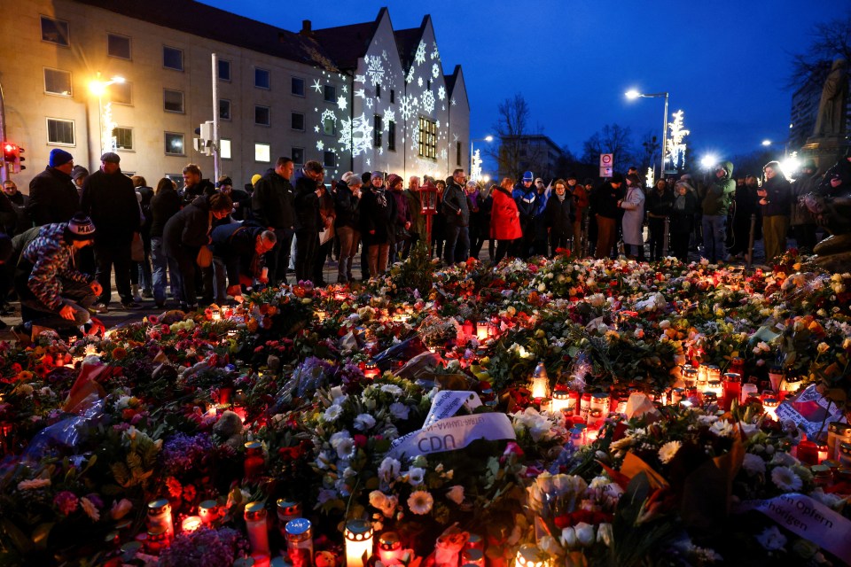 Memorial of flowers and candles following a car crash at a Christmas market.