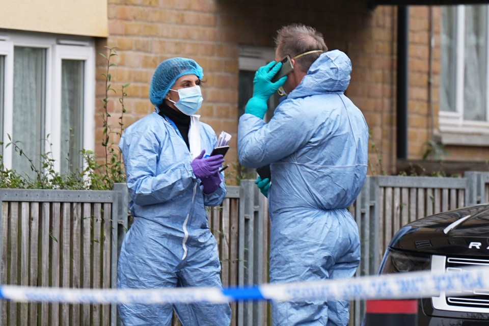 Forensic officers at a crime scene.