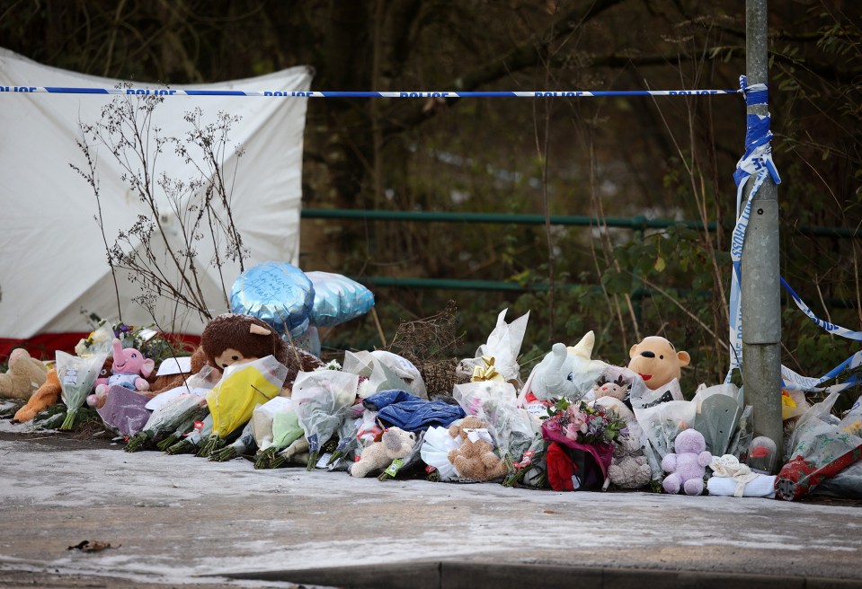 Tributes and flowers at a police scene.
