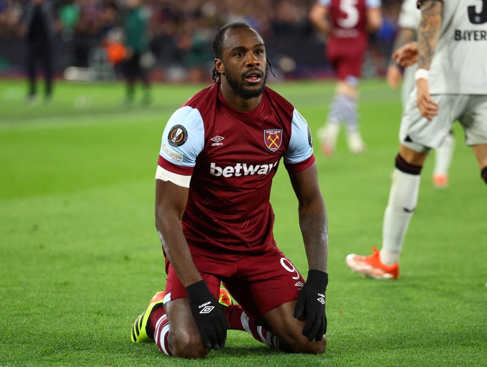 Michail Antonio of West Ham United kneeling on the field.