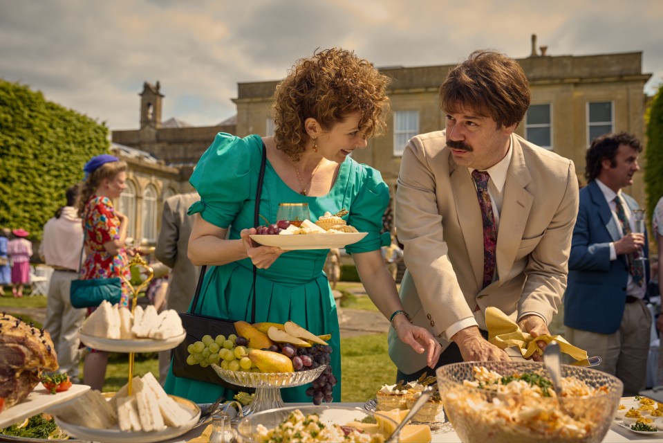 Katherine Parkinson and David Tennant at a catered outdoor event.