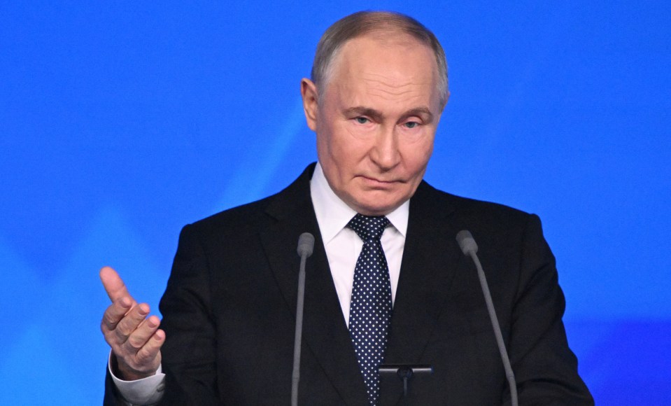 Vladimir Putin speaking at a podium.
