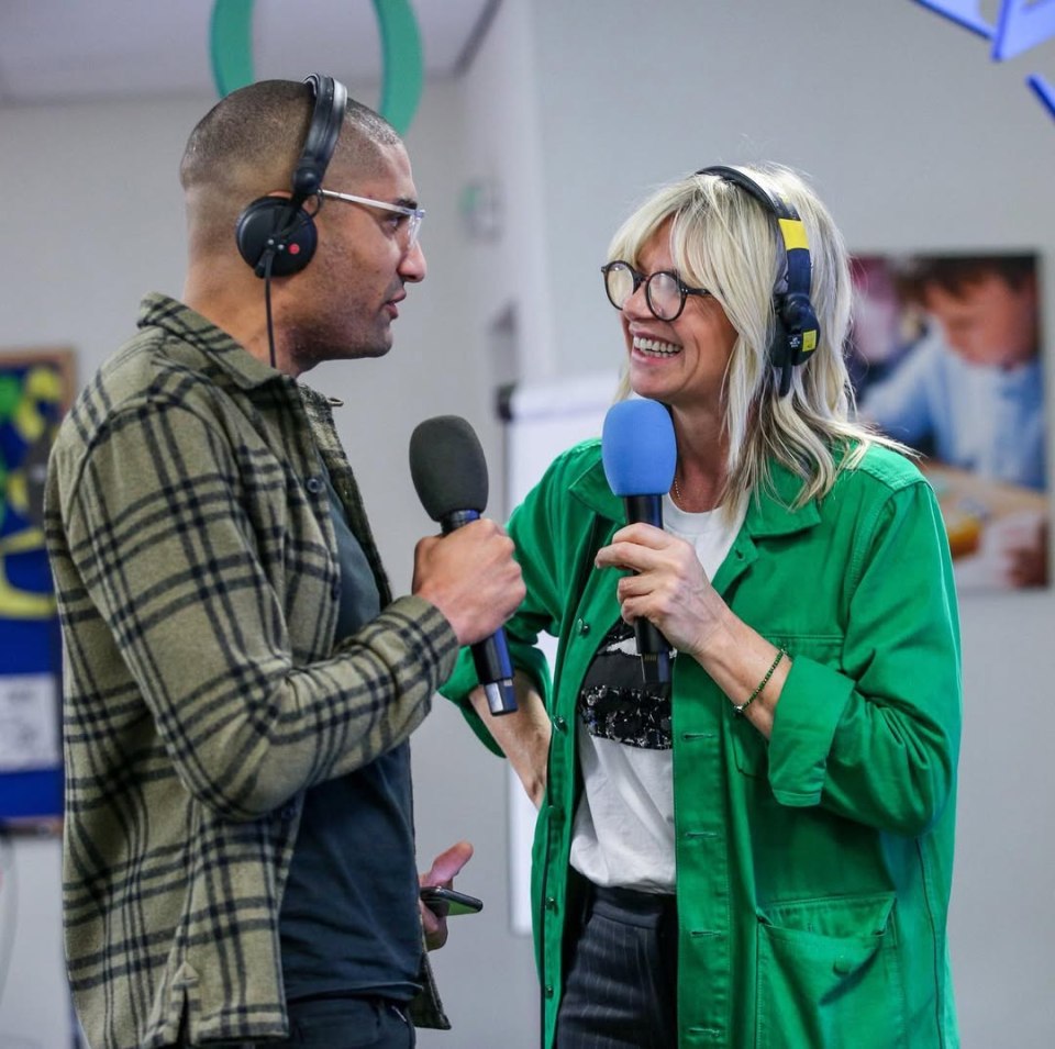 Two radio hosts holding microphones.