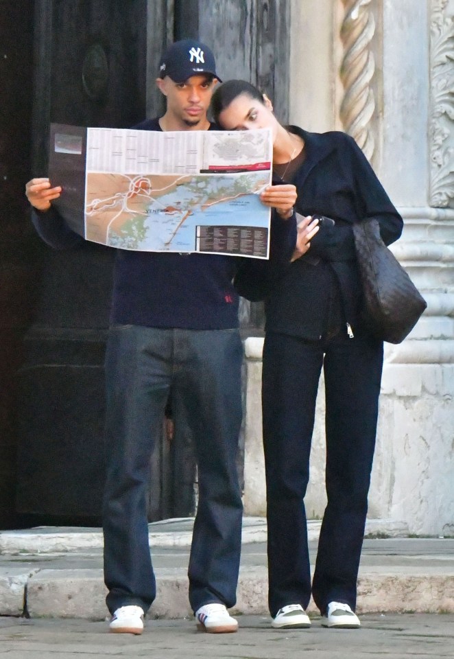 Trent Alexander-Arnold and Estelle Behnke looking at a map in Venice.