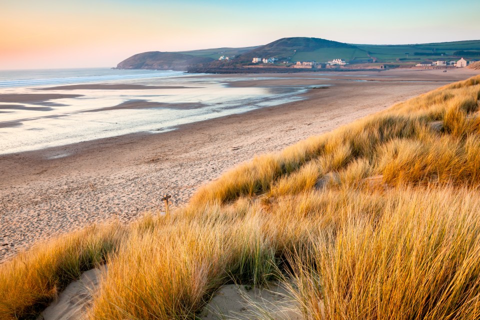 Sunset over Croyde Bay beach in North Devon, England.