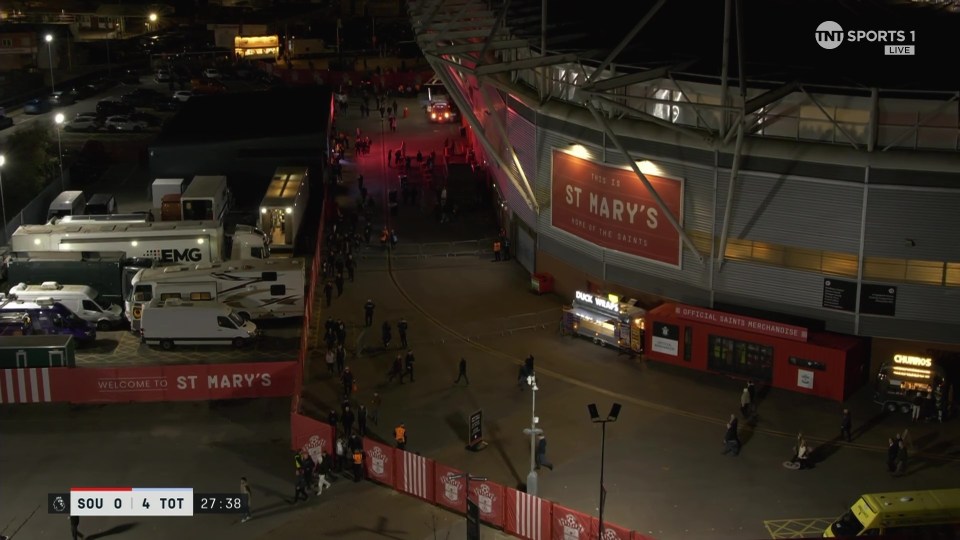 Nighttime aerial view of St. Mary's Stadium before or after a Southampton vs. Tottenham Hotspur football match.