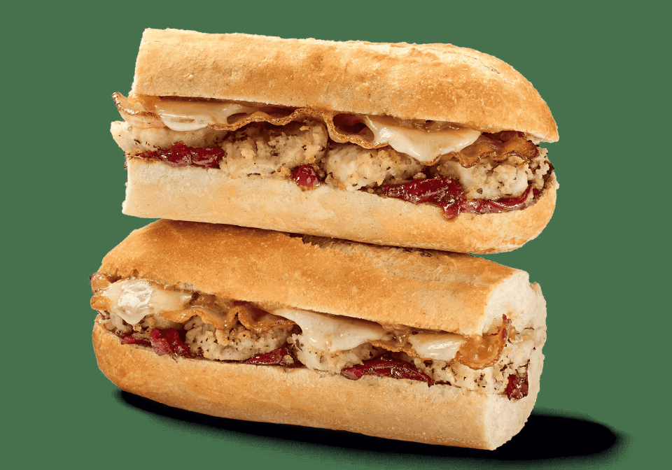 Two Greggs Christmas baguettes stacked on top of each other.