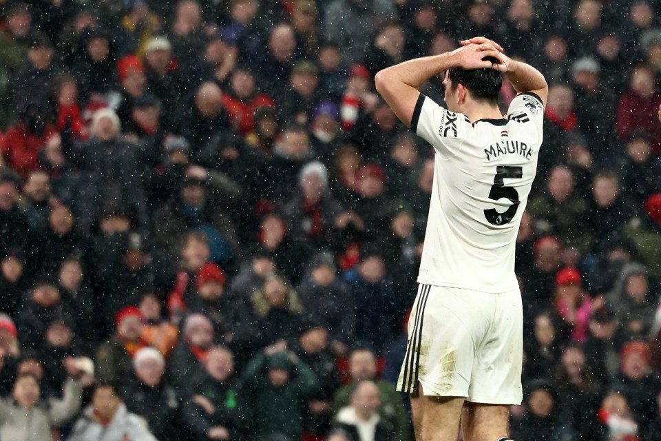 Harry Maguire reacts after missing a late chance during a Liverpool and Manchester United football match.