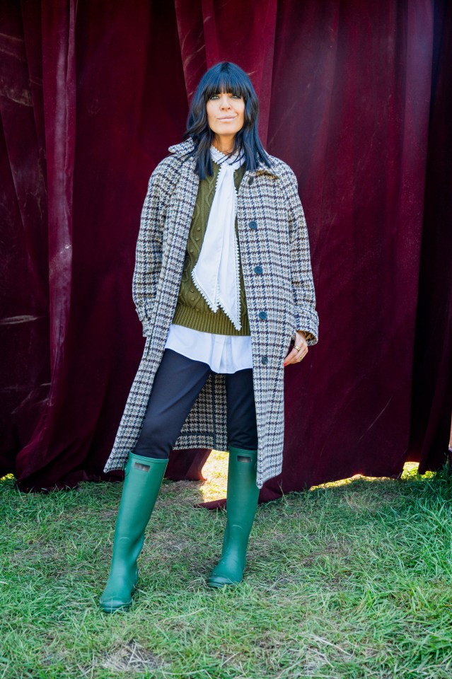 Claudia Winkleman in a tweed coat and green boots.