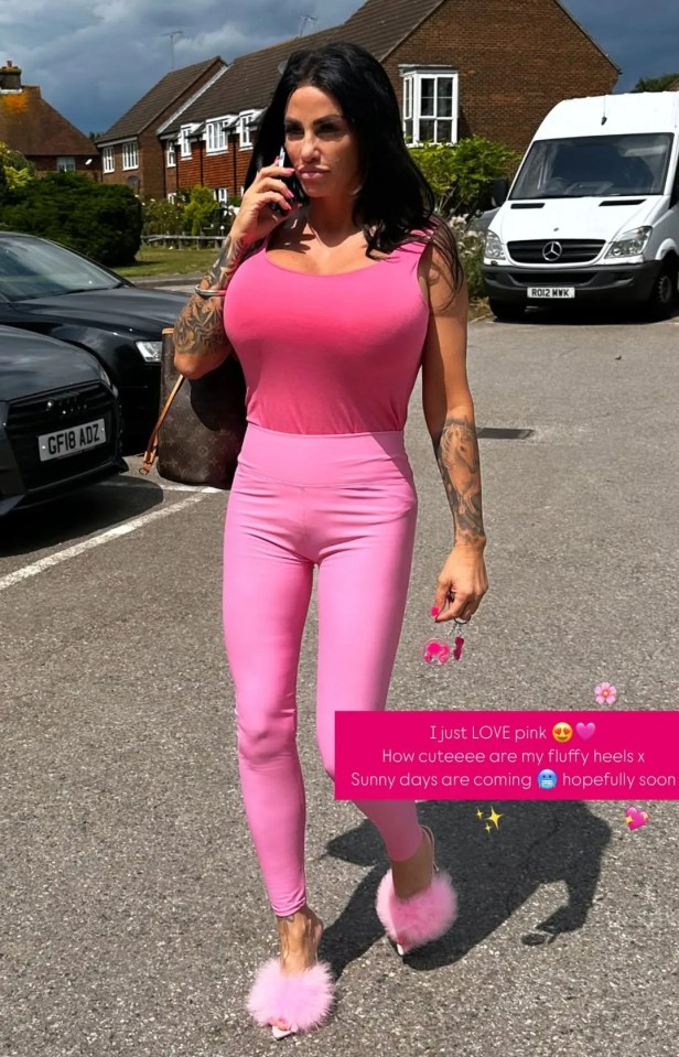 Woman in pink outfit on the phone.