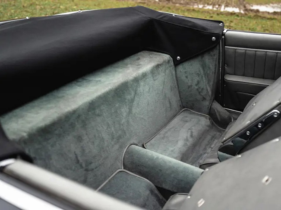 Grey leather interior of a 1958 BMW 507 Roadster, showing the seats and carpeting.