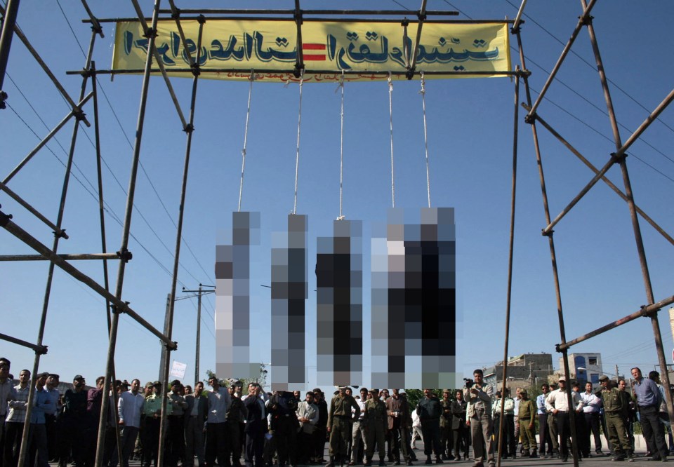 Public hanging in Mashhad, Iran. Five people are visible hanging from nooses.