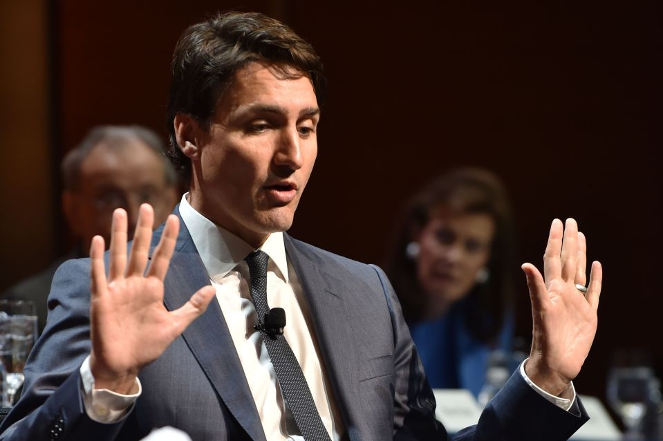 Justin Trudeau speaking with his hands raised.