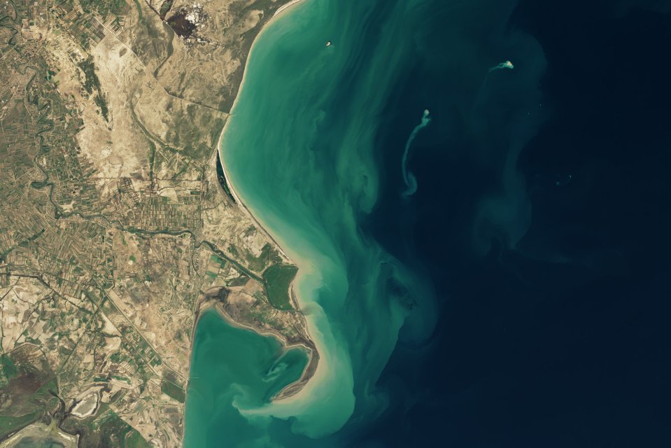 Satellite image of a transient island in the Caspian Sea near Azerbaijan, formed by a mud volcano eruption.