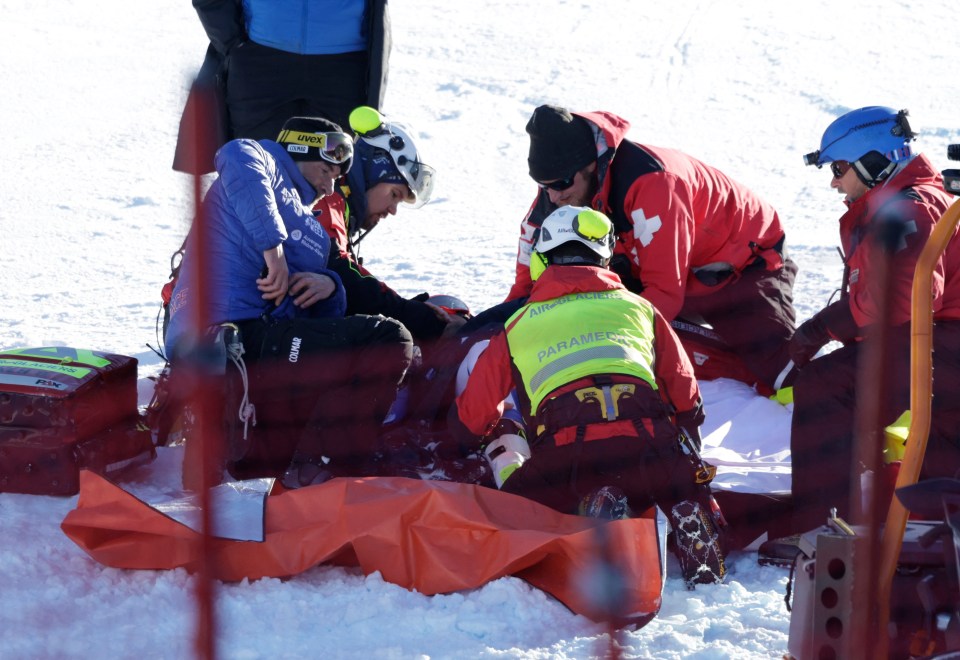 Ski racer Alexis Pinturault receiving medical attention after a crash.