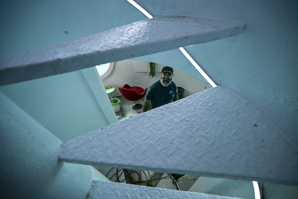 Man in underwater room.