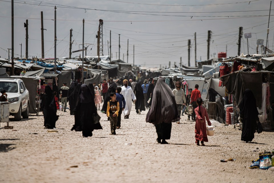 Syrian women and children leaving a camp in Hasakeh province.