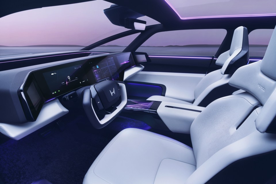 Interior view of the Honda 0 Series electric vehicle prototype, showcasing its dashboard and seats.