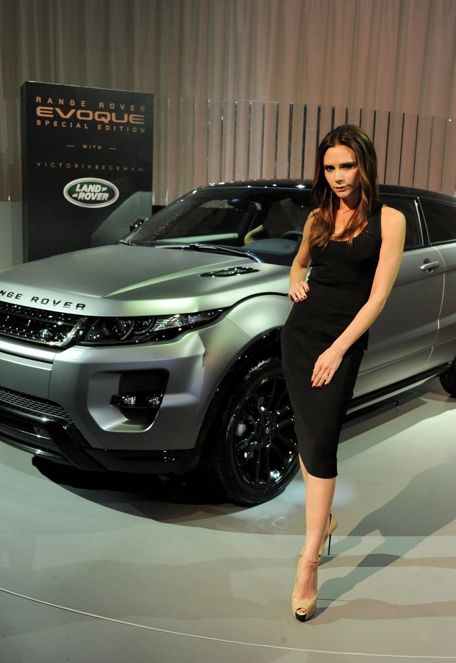 Jamie Oliver standing next to a Range Rover Evoque.