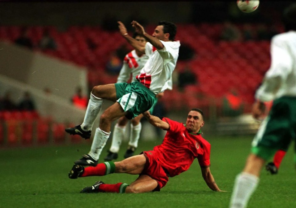 Vinnie Jones tackling Hristo Stoichkov during a Wales v Bulgaria soccer match.