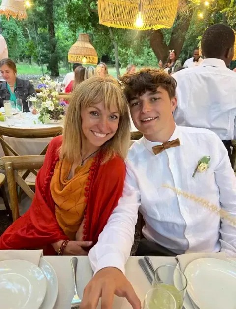 Michaela Strachan and her son at a wedding.