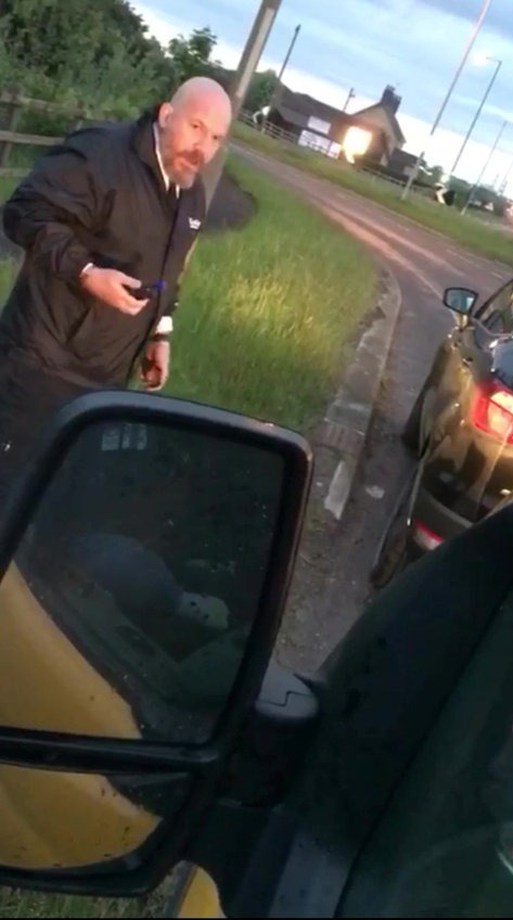 Police officer grabbing a man by the throat and punching him.