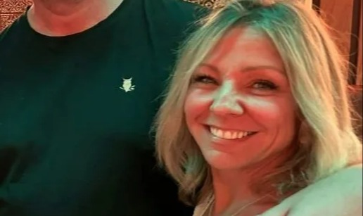 A man and woman posing for a photo.