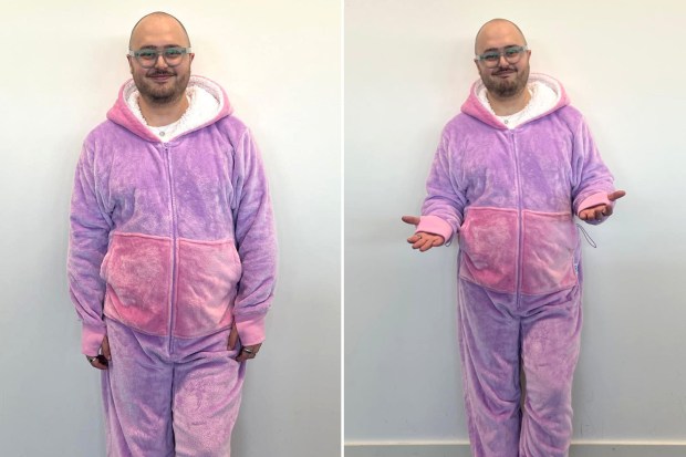 Person wearing a purple and pink oversized hoodie.