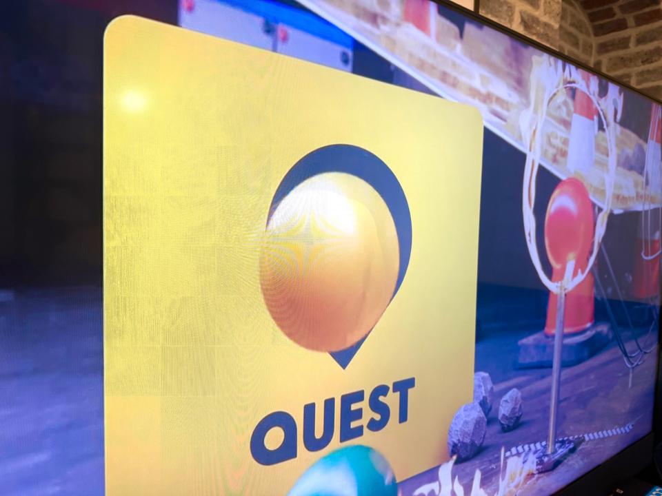 Quest logo on a screen.