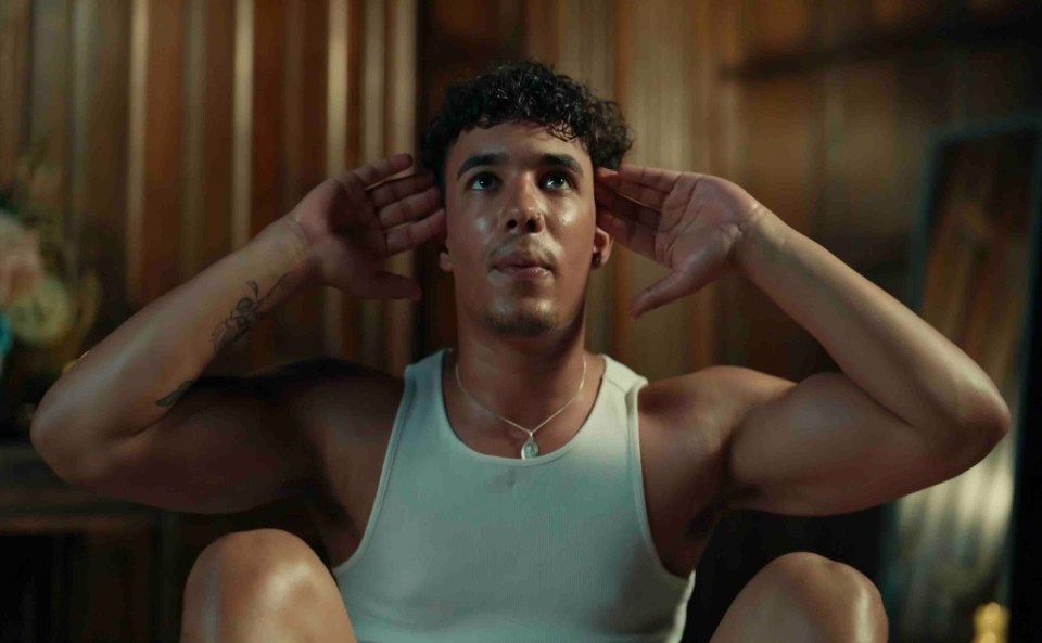 A young man doing sit-ups.