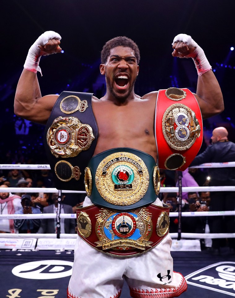 DIRIYAH, SAUDI ARABIA - DECEMBER 07: Anthony Joshua poses for a photo with the IBF, WBA, WBO & IBO World Heavyweight Title belts after the IBF, WBA, WBO & IBO World Heavyweight Title Fight between Andy Ruiz Jr and Anthony Joshua during the Matchroom Boxing 'Clash on the Dunes' show at the Diriyah Season on December 07, 2019 in Diriyah, Saudi Arabia (Photo by Richard Heathcote/Getty Images)