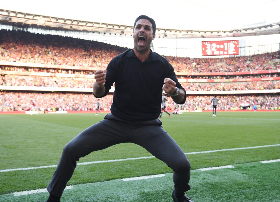 Mikel Arteta celebrating at a soccer game.