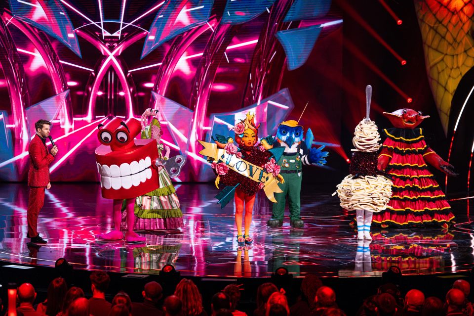The Masked Singer contestants: Teeth, Snail, Tattoo, Kingfisher, Spaghetti Bolognese, and Dressed Crab.