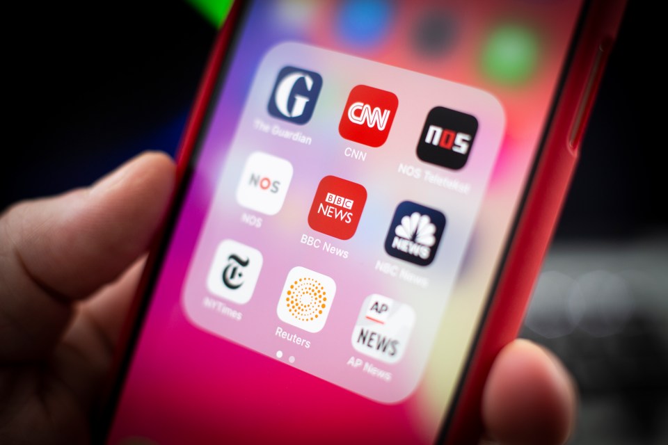 iPhone displaying news app icons.