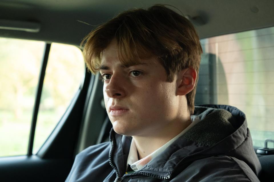 Close-up of Louis Ashbourne Serkis as Johnny Williams in a car.