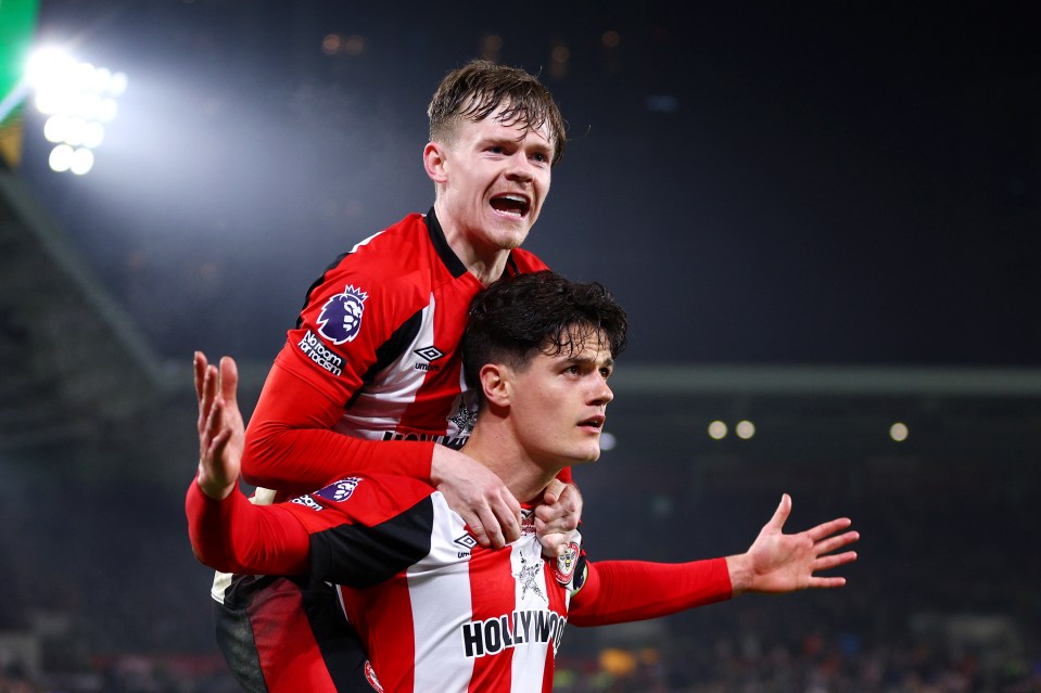 Brentford's Christian Norgaard celebrates with teammate Keane Lewis-Potter after scoring a goal.