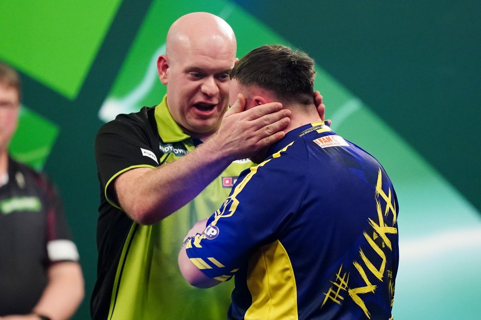 Michael van Gerwen congratulates Luke Littler after a darts championship win.