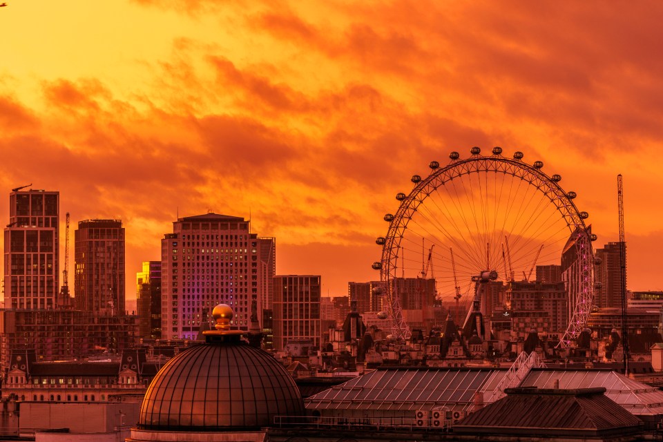 London skyline at sunset with the London Eye.